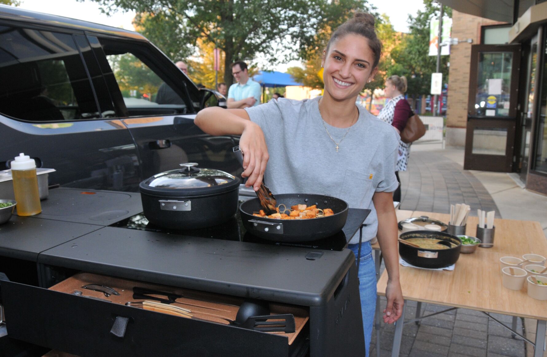Rivian chef Alex Doody cooks in the Rivian RT1 camp kitchen